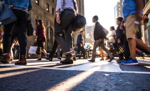 People walking across a pedestrian crossing
