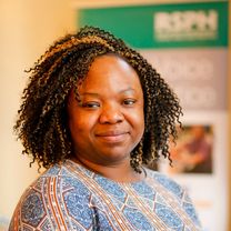 Adanma Chrys-Chikere, a black woman with short black curly hair