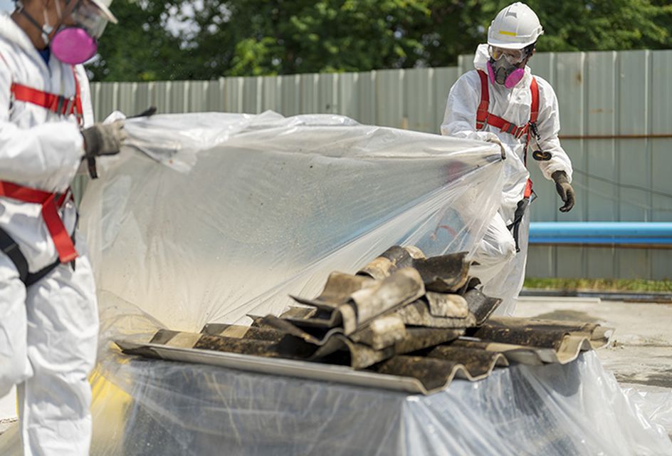Construction workers removing asbestos