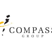 The Compass Group logo, showing serif font that reads "Compass Group" alongside an icon showing a compass made up of pen strokes.