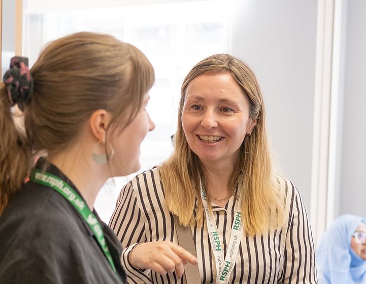 RSPH member speaking with a staff member at the 2025 members open day