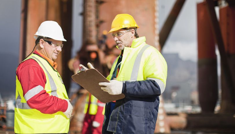 Two construction workers having a conversation