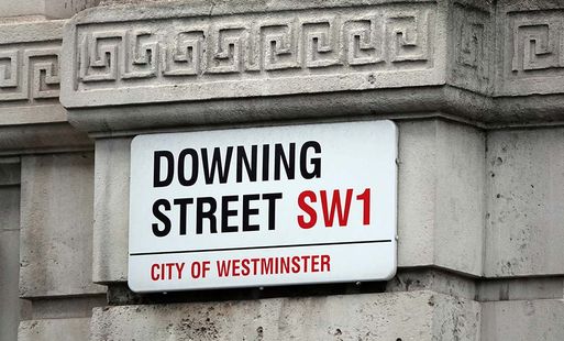 A street sign reading "Downing Street"
