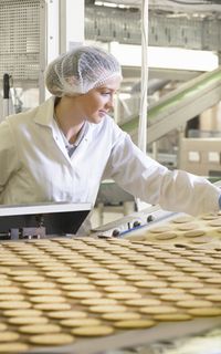 A food safety worker inspecting food