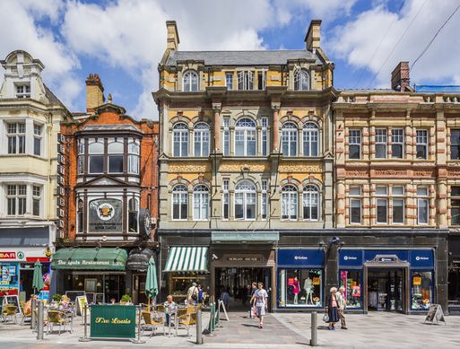 A sunny high street full of shops