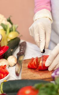 A person chopping vegetables for a healthy meal