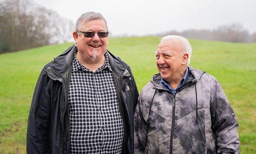 Two older men having a conversation
