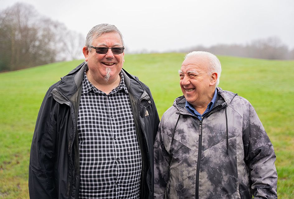 Two older men having a conversation