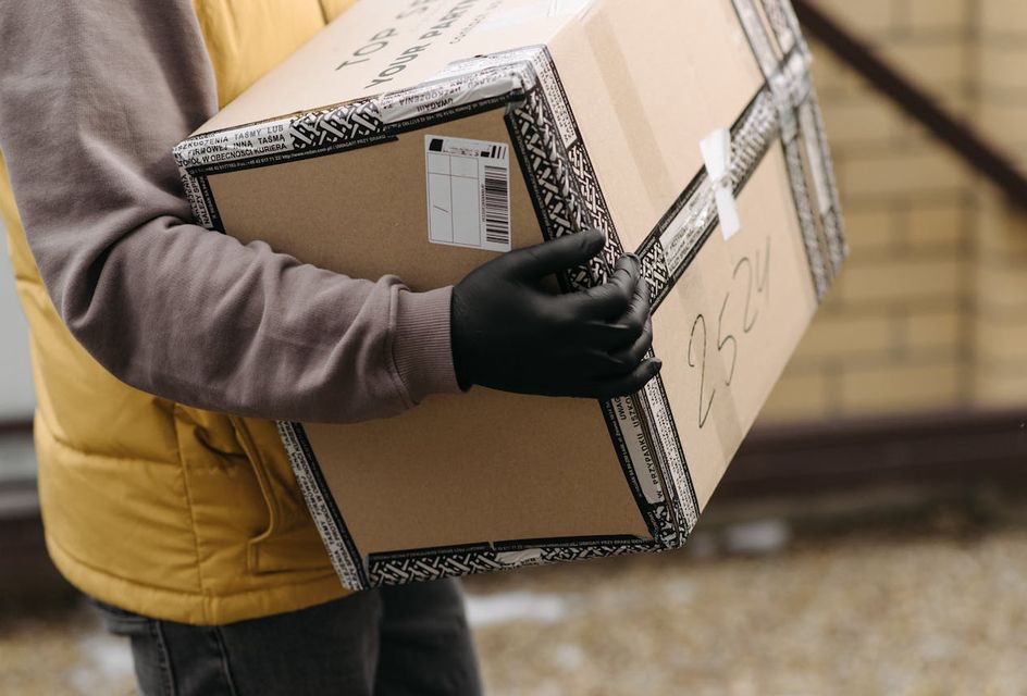 A courier holding a package