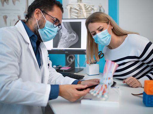 Podiatrist with a patient